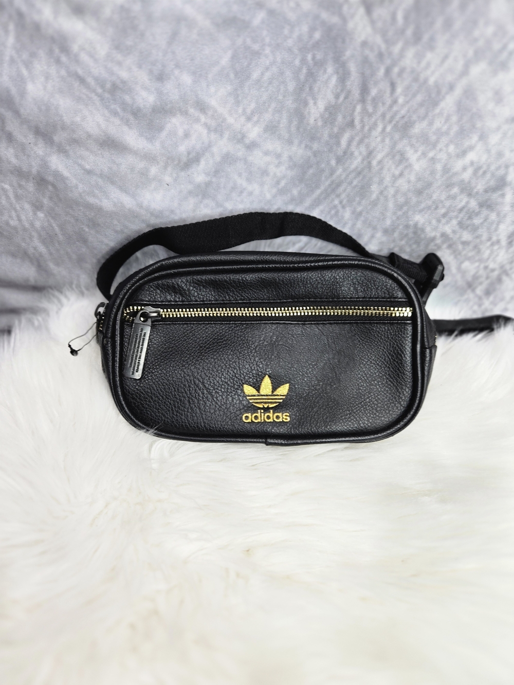 adidas Originals PU Leather Waist Pack in the black and gold colorway.